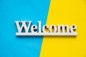 Top view for Welcome sign on a colorful background. photo