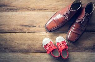 The shoes of father and son - concept take care photo