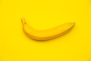Banana on yellow background photo