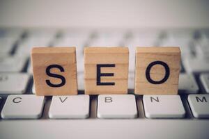 The words  S E O on the keyboard Search Engine Optimization Concept photo