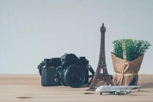 Camera, eiffel tower simulator, plane simulator, put on wooden floor Travel Planning Concepts photo