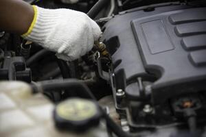 Professional mechanic is checking for engine malfunction photo