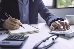 Business people are working on accounts in business analysis with graphs and documentation. photo