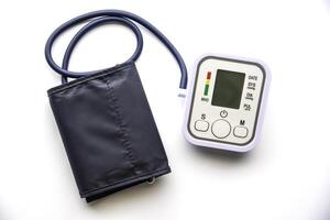 Digital Blood Pressure Monitor on white background photo