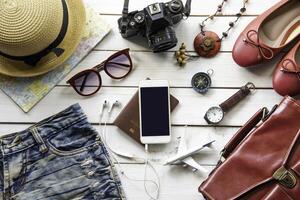 Travel accessories and costume on wooden floor photo