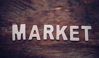 Place the word  MARKET  white on the wooden floor. photo
