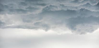 Rain clouds background.Clouds become dark gray like a big smoke before rainfall photo