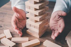 Business risks in the business. Requires planning Meditation must be careful in deciding to reduce the risk in the business. As the game drew to a wooden block from the tower photo