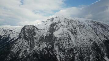 Drone view a beautiful mountain range with snow during winter. Mountain for alpine climbers. Adventurous lifestyle. video