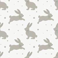 Seamless pattern with cute bunnies on a pastel background with dots. Children's print, children's bedroom design. Vector