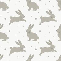 Seamless pattern with cute bunnies on a pastel background with dots. Children's print, children's bedroom design. Vector