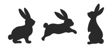 Set of silhouettes of hares, set of Easter bunnies on a white background. Festive design elements. Vector