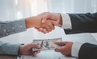 businessman was negotiating a bribery arrangement in which the dollar would be accepted as a bribe. Concepts of anti-bribery and anti-corruption photo