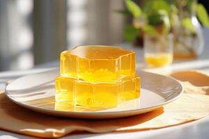 AI generated Yellow jelly on light blurred background. Sweet fruit dessert. For use in food blogs, catering services, recipe books, dessert menus photo