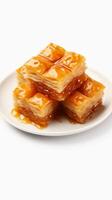 AI generated Turkish dessert baklava isolated on white background. Sweet oriental dessert with honey glaze and nuts. Vertical format. photo