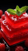 AI generated Vibrant red jelly adorned with raspberries. Sweet fruit dessert. For use in culinary websites, food blogs, catering services, recipe books, and dessert menus. Dark background. Vertical photo