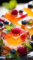 AI generated Fruit jelly cubes garnished with berries and mint on a plate. For use in Catering display, dessert menu, food blogging, culinary presentations. Vertical format. photo