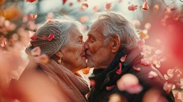 AI generated Affectionate elderly couple shares heartfelt kiss amidst a soft background of red rose petals, evoking everlasting love. Ideal for greeting cards and sentimental themes. Valentines day photo