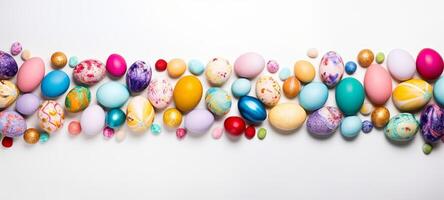 AI generated Assortment of colorful hand-painted Easter eggs on a white background. Perfect for use in seasonal promotions, festive Easter content, and holiday invitations. Top view. With copy space photo