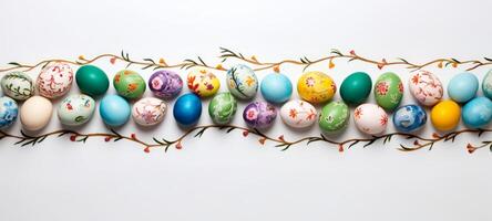 AI generated A variety of hand-painted Easter eggs lie in a row, decorated with intricate patterns and vivid colors. On white background. With copy space. Ideal for seasonal advertising photo