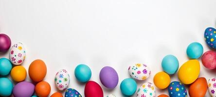 AI generated Top view of colorful Easter eggs creating a border on a white background, leaving ample copy space. Perfect for festive social media content, print advertisements. Festive backdrop photo