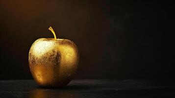 AI generated Golden apple made of gold, on a dark background with a textured, sparkling surface. Suitable for concepts of wealth, luxury, and temptation in art and advertising. Banner with copy space. photo