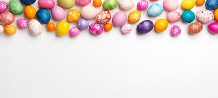 AI generated Brightly colored Easter eggs arranged at the top edge of a white background. Ideal for springtime promotions, holiday greeting cards, and seasonal event announcements. Banner photo