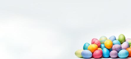 AI generated Assortment of colorful hand-painted Easter eggs on white background. Top view. Banner with copy space. Perfect for use in seasonal promotions, festive Easter content, and holiday photo