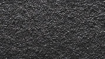 AI generated Top view of Black sesame seeds. Background texture of raw Black sesame seeds. Superfood. Copy space. Banner. Ideal for culinary and food concepts photo