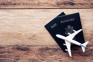 top view  passport  on wooden table, for travel concept photo