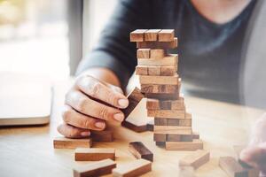 Business risks in the business. Requires planning Meditation must be careful in deciding to reduce the risk in the business. As the game drew to a wooden block from the tower photo