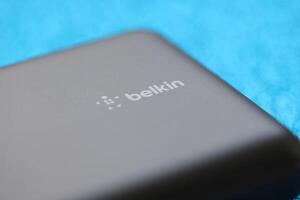 KYIV, UKRAINE - MAY 4, 2022 Portable Powerbank battery with logo of Belkin International photo