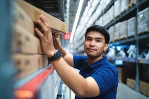 worker in blue uniform Happy workers in the distribution center. supply chain and logistic network technology concept. photo