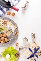 Festive vertical background for Jewish Passover holiday with traditional food and symbols. The concept of the Passover holiday. photo