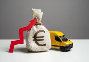 Delivery van and euro money bag with red arrow up. Transport industry. Trade and sale of goods. High customer costs for online shopping. Increased profits when delivering online orders. photo