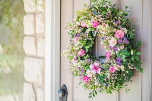 AI generated Spring flower wreath hanging on a house wooden door. Fresh wild flowers and home decoration. Generative AI photo