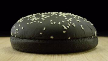 Bun for burgers of black colors. Stock footage. Close up of black sesame bun for Burger video