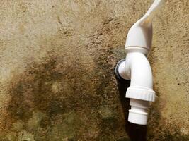 A photo of a white water tap. Perfect for magazines, newspapers, tabloids