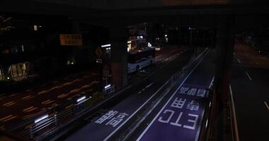 A night traffic jam at the city street under the highway wide shot video