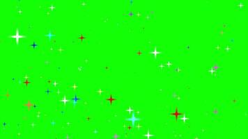 Motion graphics of the twinkle glitter colorful star sparkling behind green background video