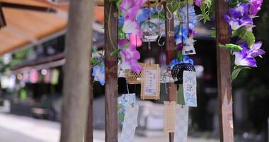 A wind chime swaying in summer day time video