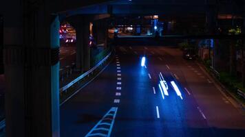 A night timelapse of the traffic jam at the city street under the highway in Tokyo video