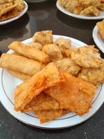 Fried food or Gorengan typical of Indonesia made from wheat, tempeh, vegetables. This photo is perfect for magazines, newspapers, cookbooks, advertisements, banners, posters