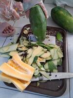 A photo of a papaya being peeled. Perfect for newspapers, magazines and tabloids