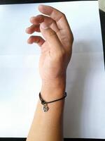 Photo of bracelet with zodiac pendant. This photo is suitable for advertising photos, calendars, magazines, posters, banners