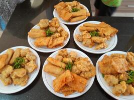 Fried food or Gorengan typical of Indonesia made from wheat, tempeh, vegetables. This photo is perfect for magazines, newspapers, cookbooks, advertisements, banners, posters