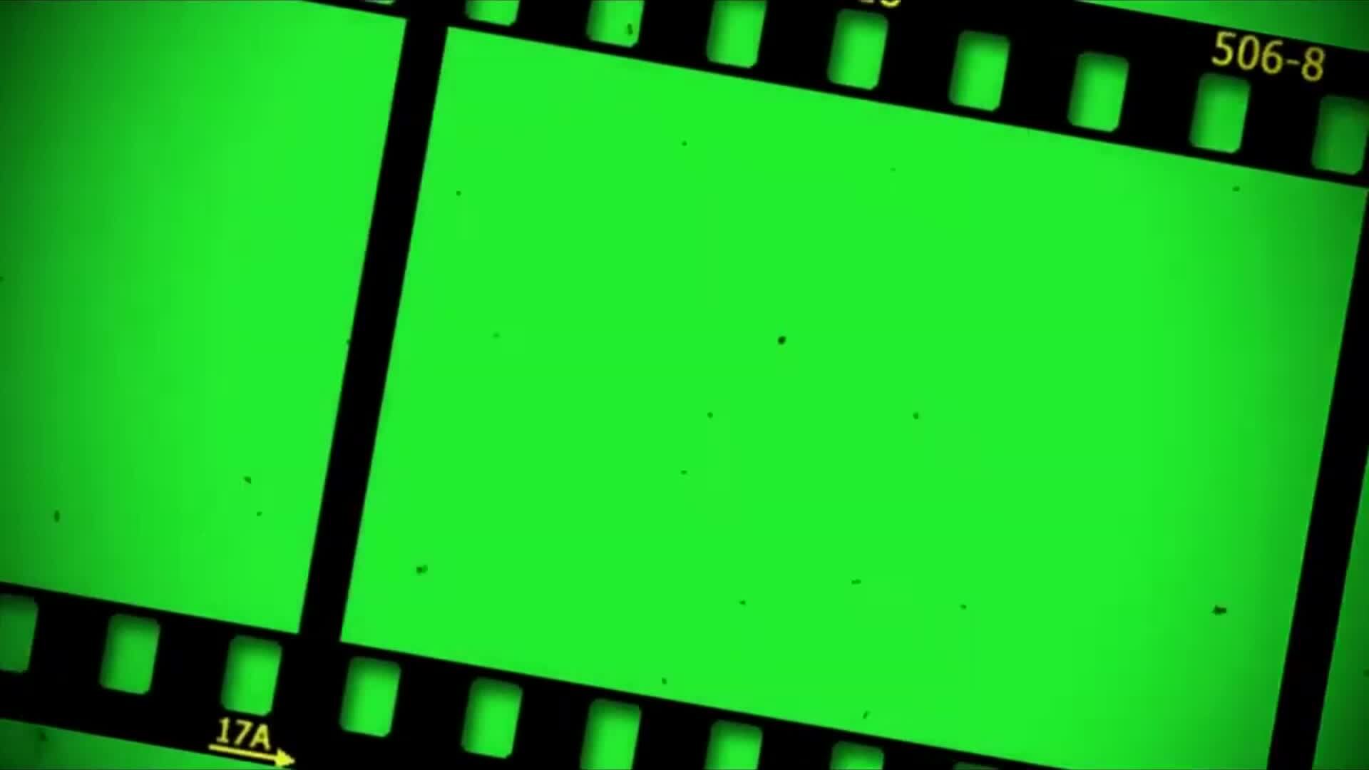 Old cinema negative film strip motion vertical horizontal green screen