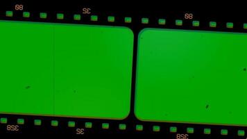 Old cinema negative film strip motion vertical horizontal green screen keylight video