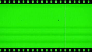 Old cinema negative film strip motion vertical horizontal green screen keylight video