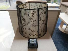 Photo of decorative lamp on the table. Perfect for magazines, newspapers and tabloids